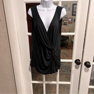 Black blouse, sleeveless, v- neck, rayon, with a little gathering on the hip